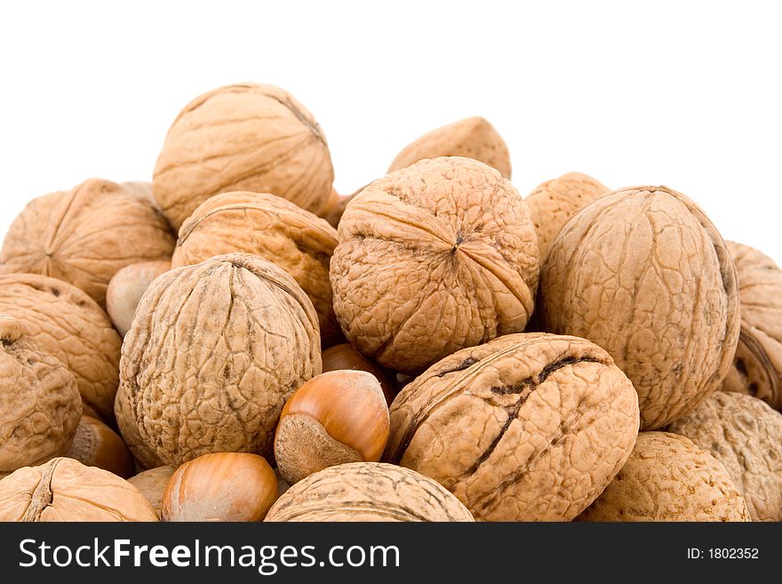 Nuts, walnuts, hazelnuts, almonds isolated on white background