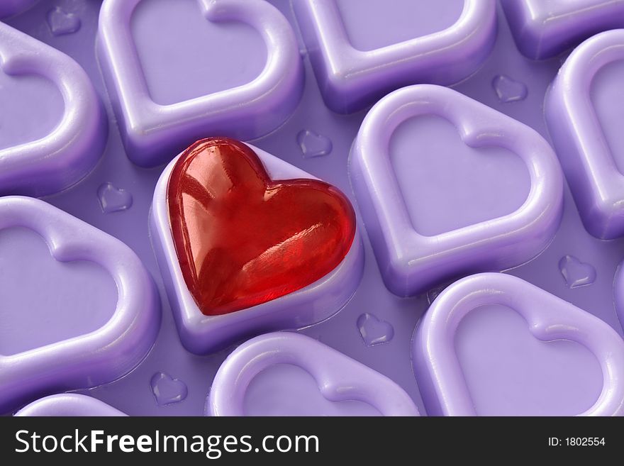 Valentine heart on the violet background - the symbol of love. Valentine heart on the violet background - the symbol of love