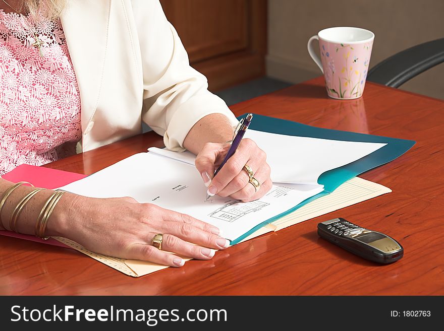 Business woman busy with paper work 6