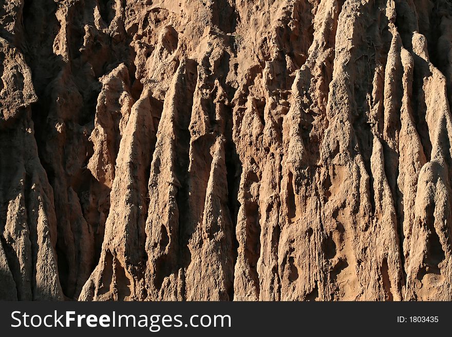 Orange colored dirt cliffs in California. Orange colored dirt cliffs in California