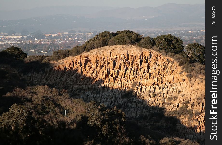 Orange colored dirt cliffs in California. Orange colored dirt cliffs in California