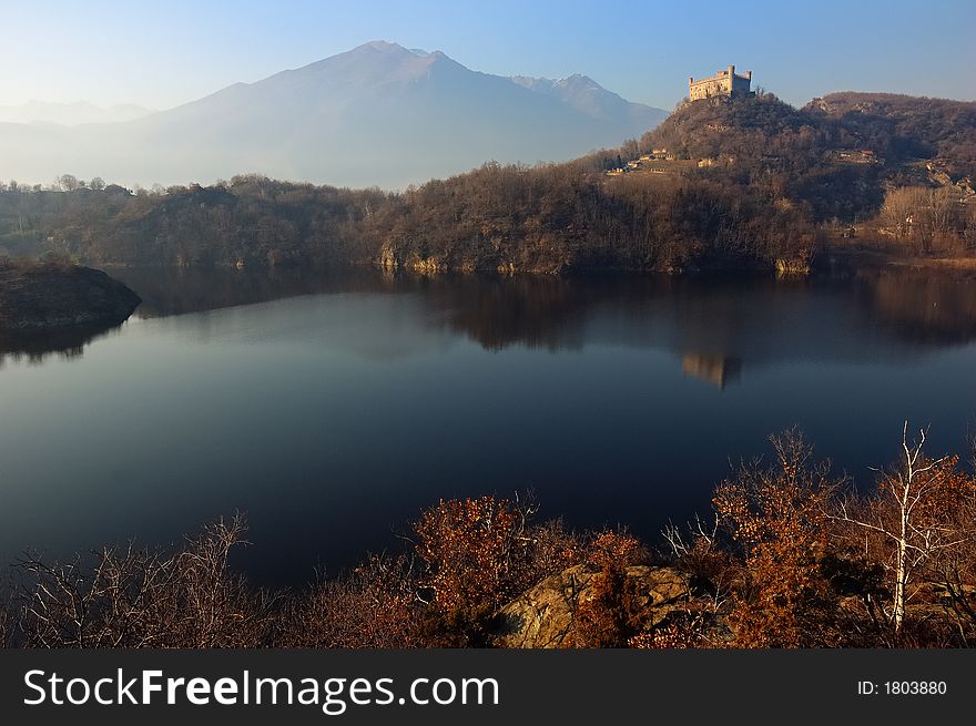 Ancient castle reflected in an alpine lake, Ivrea, north Italy. Ancient castle reflected in an alpine lake, Ivrea, north Italy.