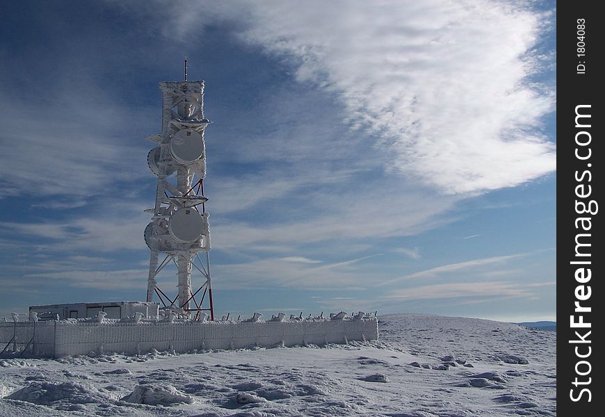 Observatory on the top of the mountain on a windy winter day