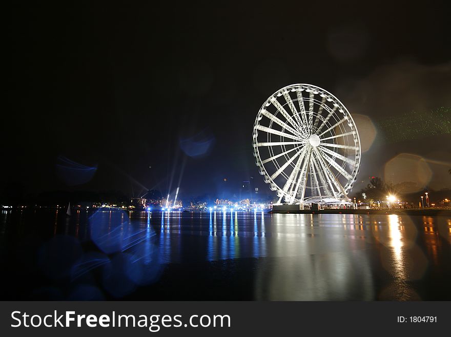 "Eye on Malaysia" Ferris wheel stands next to Petronas Twin Towers in Kuala Lumpur.