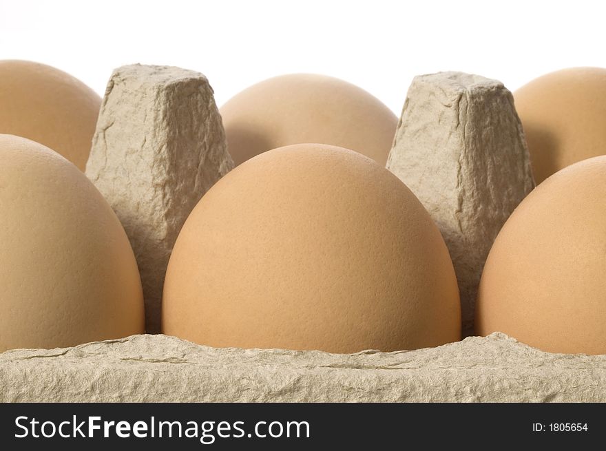 Eggs in a grey cardboard carton boxeggs isolated on the white background