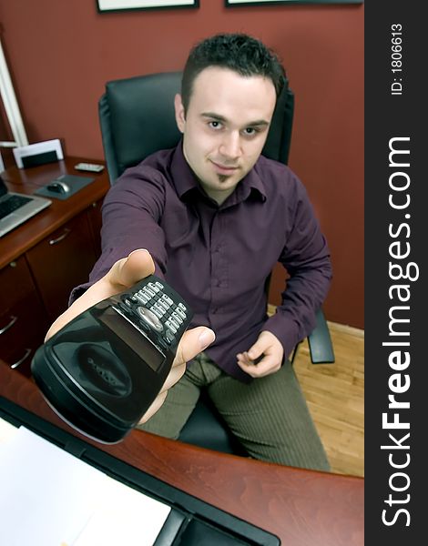 Businessman in office with phone