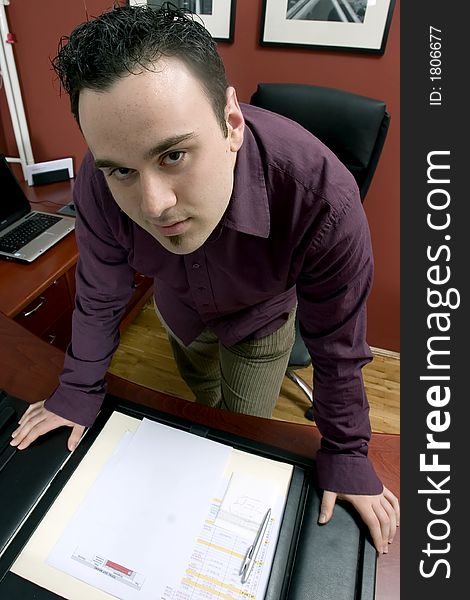 Businessman in office with document