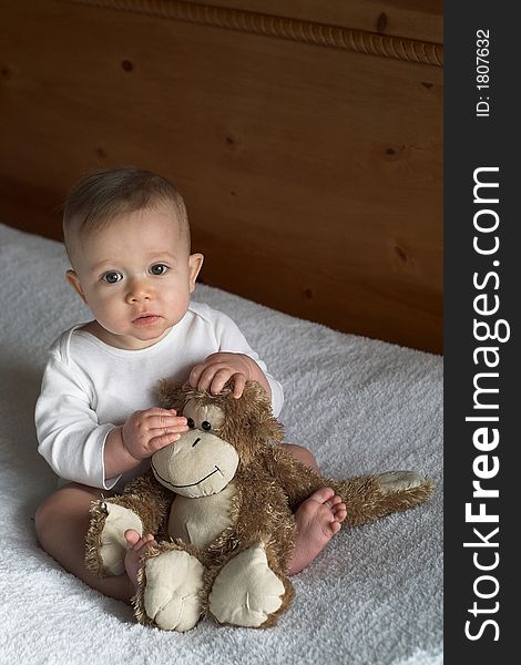 Image of baby holding a stuffed toy. Image of baby holding a stuffed toy