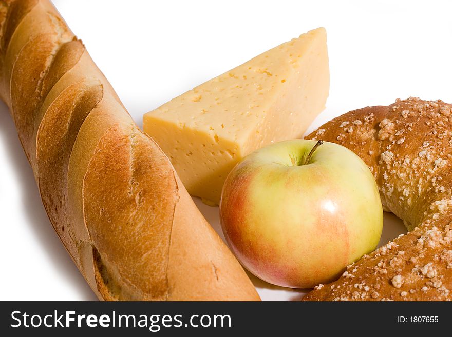 Breakfast - bread, cheese and apple, with copy space, on white background. Breakfast - bread, cheese and apple, with copy space, on white background.