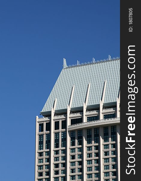 Modern skyscrapers against a bright blue sky