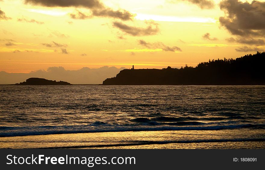 Dawn of a new day with lighthouse on peninsula. Dawn of a new day with lighthouse on peninsula