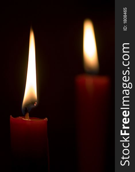 Red candles on dark background