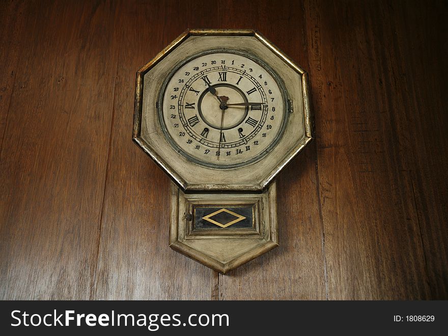 Antique clock with a calendar function. Antique clock with a calendar function.