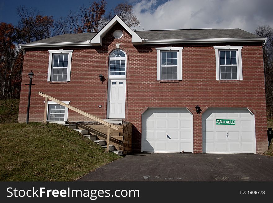 Multi Level Brick Home in suburbia that is available for sale.