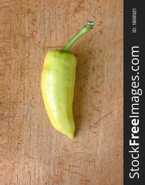 Green pepper on wood