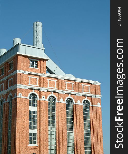 Perspective of old power plant with wall in brick