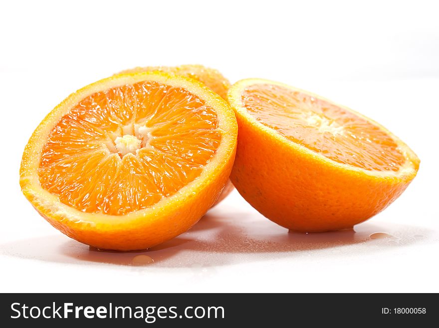 Oranges isolated on white background cut in two