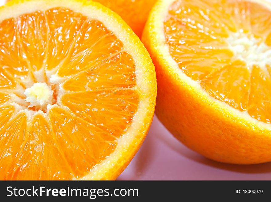 Oranges isolated on white background cut in two