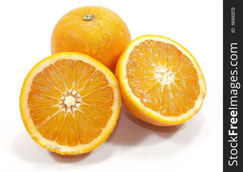 Oranges isolated on white background cut in two