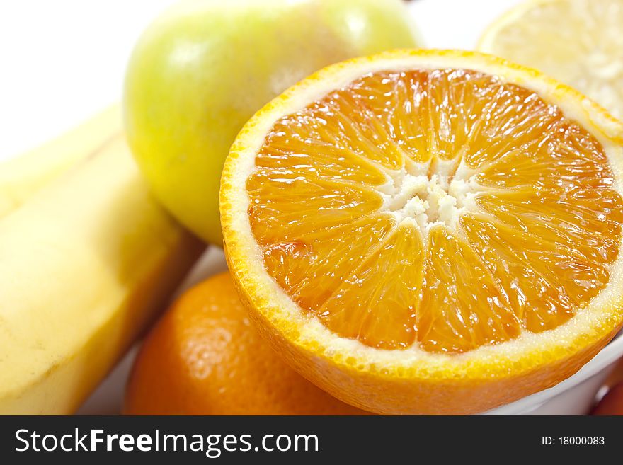 Different fruits on white background, shot close.