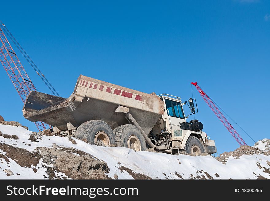 Dump Truck on a Construction Site in Winter