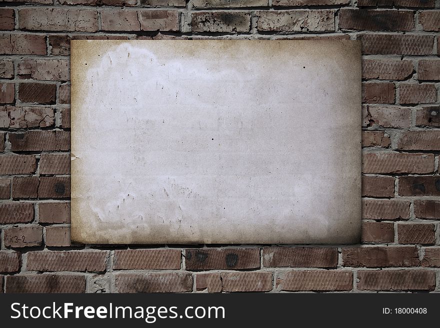 Old paper on brickwall, vintage background