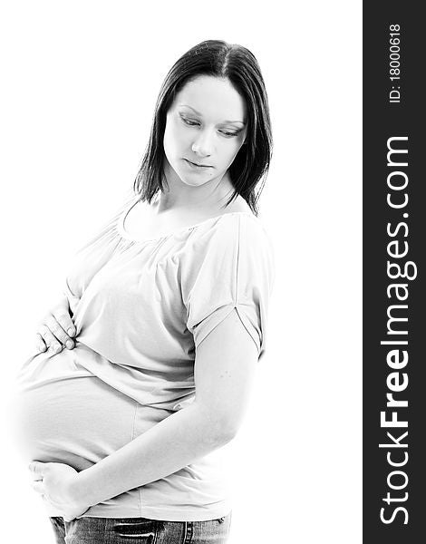Young and beautiful pregnant woman isolated on white background