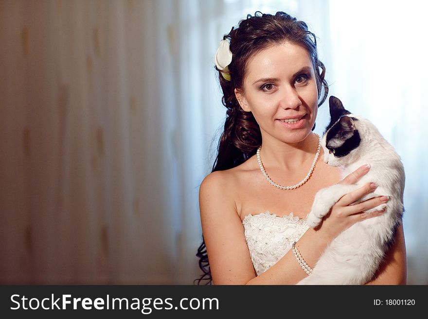 Bride with a Siamese cat. Bride with a Siamese cat