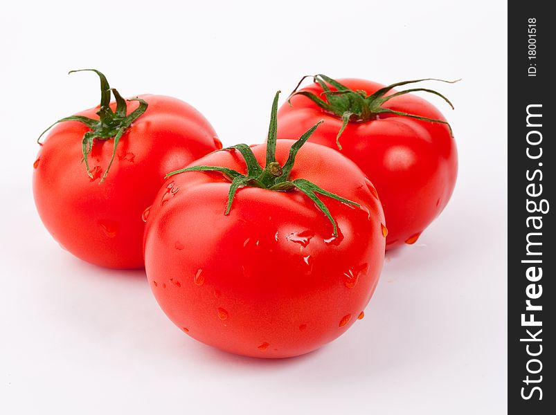 Red tomatoes vegetable with cut isolated on white background