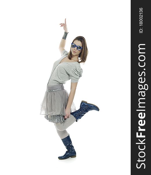 Young woman in cool clothes pointing up. Young woman in cool clothes pointing up