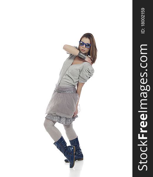 Young woman in cool clothes posing against white background. Young woman in cool clothes posing against white background