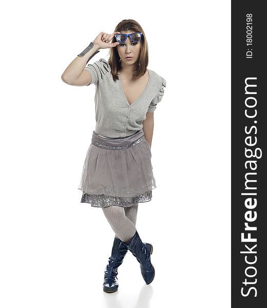 Young woman in cool clothes posing, lifting her sunglasses. Young woman in cool clothes posing, lifting her sunglasses