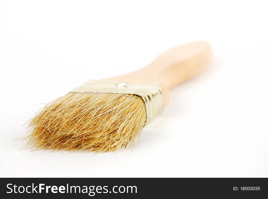 Wooden brush on a white background