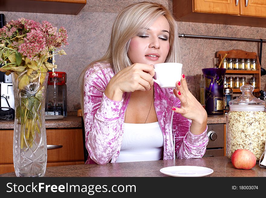 Woman sniffing the scent cup of hot drink