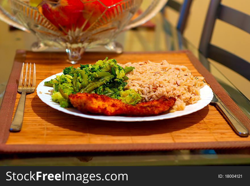 Rice, vegetables and chop on a plate. Rice, vegetables and chop on a plate