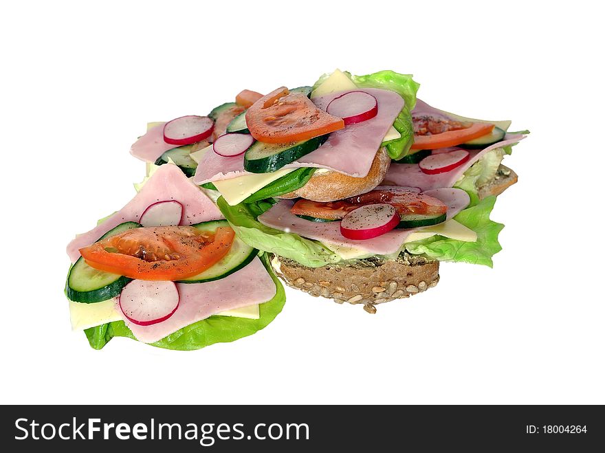 Appetizing sandwich from ham lettuce and tomato on white background