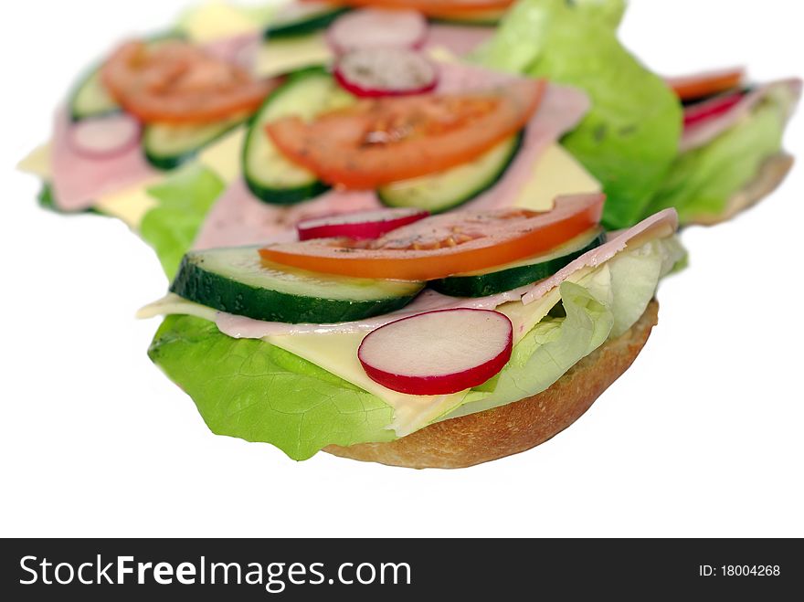 Appetizing sandwich with ham and lettuce on white background