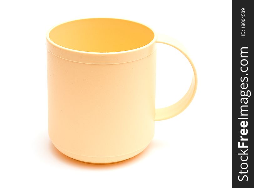 Empty plastic mug with handle isolated on white background