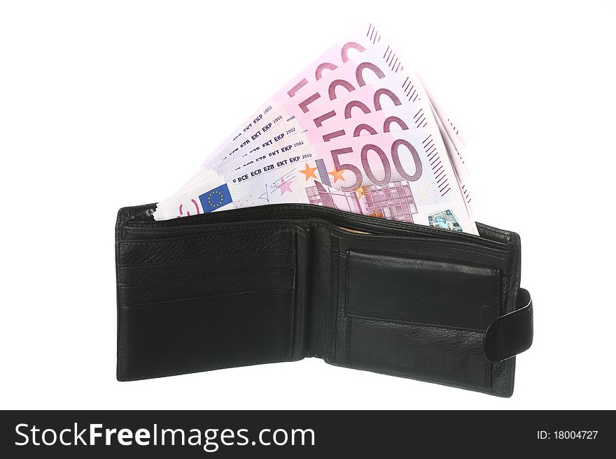 Close-up of five-hundredth euro banknotes in black leather wallet isolated on white. Close-up of five-hundredth euro banknotes in black leather wallet isolated on white