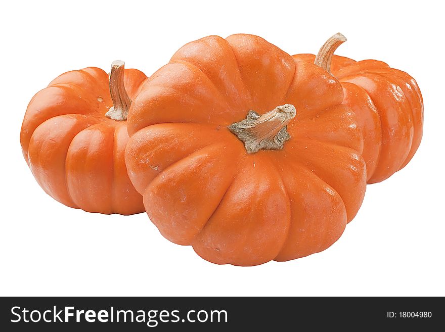 Small orange pumpkins symbolising autumn holidays and used in decorative works.