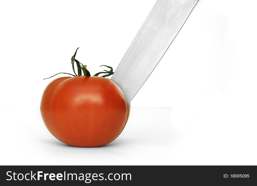 Tomato and knife on white background. Tomato and knife on white background