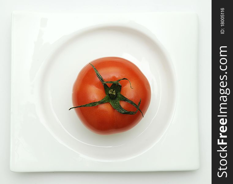 Tomato On Plate.