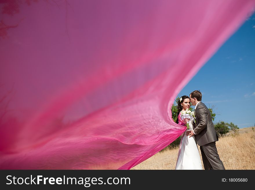 Bride and groom with the pink shawl. Bride and groom with the pink shawl