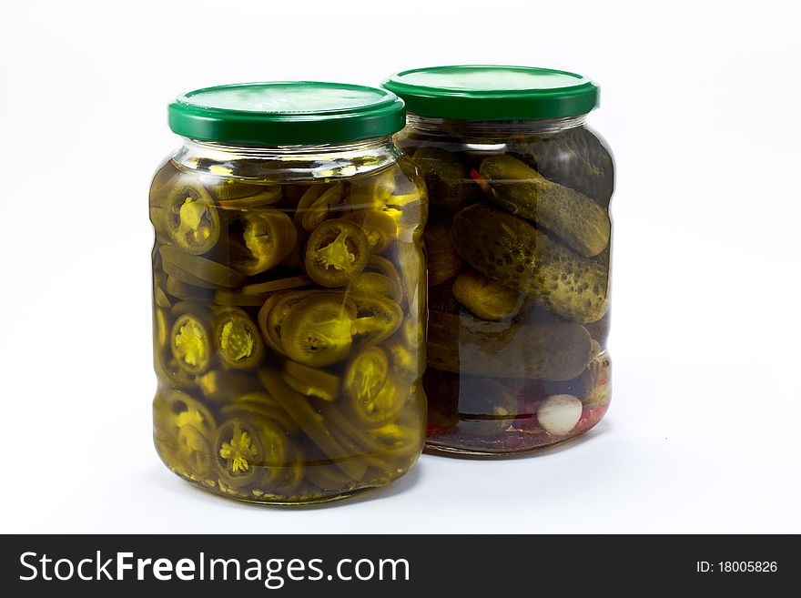 Pickle and jalapeno jar isolated on white