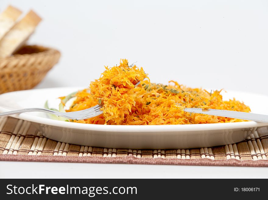 Salad from carrots on a plate. Salad from carrots on a plate