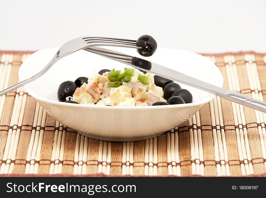 Salad with vegetables and black olives.