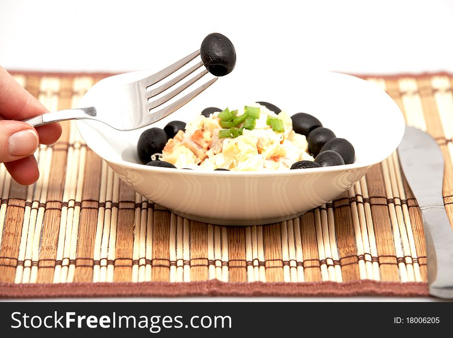 Salad with vegetables and black olives.