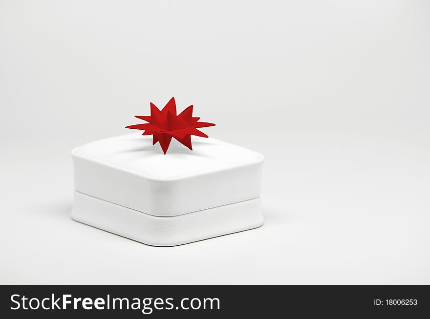 Close-up image of leather gift box on bright background.