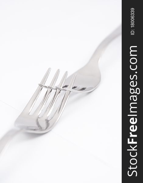 Two silver forks isolated over white background.