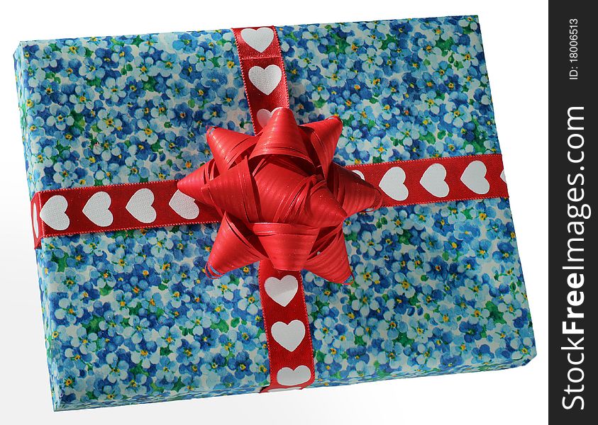 Blue box with a red hearts ribbon and a red bow. Blue box with a red hearts ribbon and a red bow